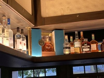 Photograph of bottles behind the bar