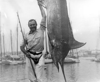 Ernest Hemingway posing with a marlin, Havana Harbor, Cuba, 1934